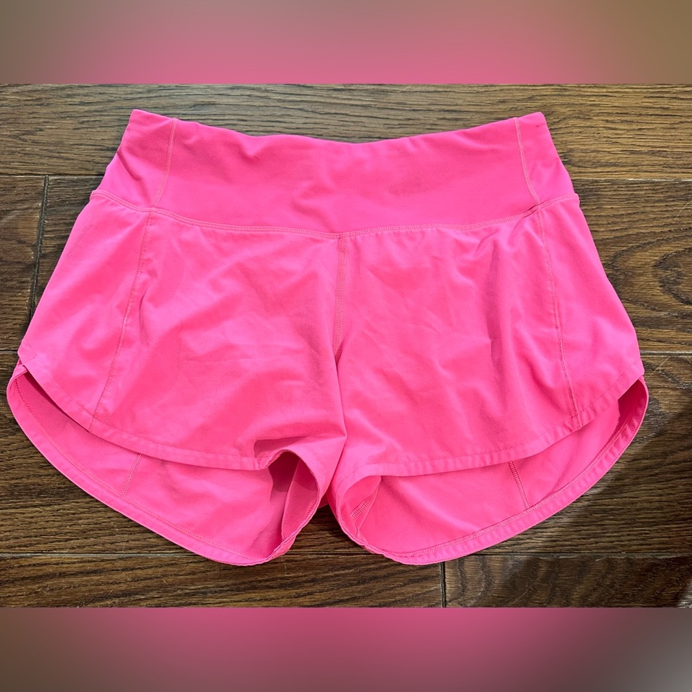 Neon Pink speed up Lululemon shorts. 4”